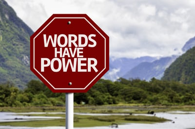 Words Have Power red sign with a landscape background